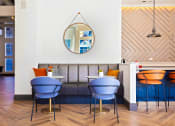 Thumbnail 16 of 19 - a dining room with a couch and tables at The Olivine, Austin, 78727