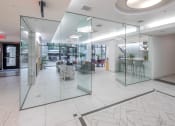 Thumbnail 32 of 46 - a large lobby with glass walls and a marble floor at The Parker Apartments, Oregon