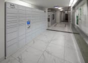Thumbnail 41 of 46 - a photo of a long white hallway with white marble floors and white lockers with a blue at The Parker Apartments, Oregon, 97209