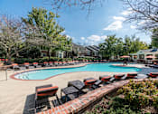 Thumbnail 16 of 38 - Resort style swimming pool with lounge chairs at Wyndchase Aspen Grove Apartments, Tennessee