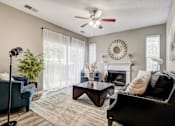 Thumbnail 5 of 38 - Living room with fireplace and ceiling fan1 at Wyndchase Aspen Grove Apartments, Franklin, 37067