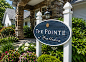 Thumbnail 12 of 33 - A sign that says "The Pointe at Wimbledon" in front of a house.