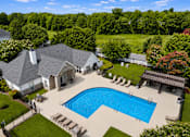 Thumbnail 3 of 33 - A large house with a pool in the backyard.