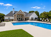 Thumbnail 6 of 33 - A large house with a pool in the backyard.