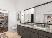 Thumbnail 5 of 40 - a bathroom with two sinks and a large mirror at The Colony, Charlotte, NC