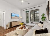 Thumbnail 4 of 40 - an open living room with a couch and a coffee table at The Colony, North Carolina