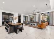 Thumbnail 34 of 40 - a large living room with white walls and tiles flooring at The Colony, Charlotte, NC