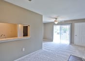 Thumbnail 10 of 17 - A room with a ceiling fan and a window with blinds.