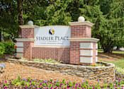 Thumbnail 1 of 19 - A sign for Stadler Place reads "Luxury Apartment Homes.".