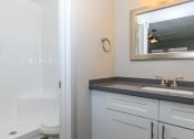 Thumbnail 13 of 19 - a bathroom with a sink and a toilet and a mirror at Tides on Southern, Mesa Arizona