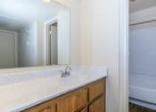 Thumbnail 17 of 19 - apartment bathroom with sink and mirror at Tides on Southern, Mesa Arizona