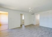 Thumbnail 13 of 21 - a bedroom with hardwood floors and white walls