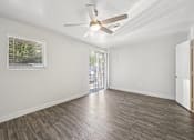 Thumbnail 29 of 54 - Unfurnished room with wooden floor and ceiling fan at Connect on University, Mesa, AZ