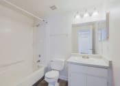 Thumbnail 5 of 21 - a bathroom with a sink toilet and a tub