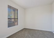 Thumbnail 7 of 21 - an empty room with carpet and a window