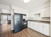 Thumbnail 36 of 54 - Kitchen with black refrigerator at Connect on University, Mesa, 85203