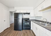 Thumbnail 37 of 54 - Kitchen with stainless steel appliances at Connect on University, Mesa, Arizona