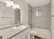 Thumbnail 5 of 9 - a bathroom with a sink and a toilet and a shower