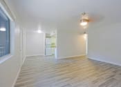 Thumbnail 3 of 14 - A room with a wooden floor and a ceiling light at Aspire Mesa, Mesa, AZ,  85210.