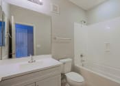 Thumbnail 6 of 23 - a bathroom with a sink toilet and a tub