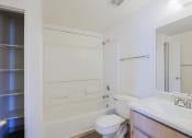 Thumbnail 13 of 21 - the preserve at ballantyne commons apartment bathroom with sink toilet and shower