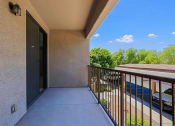 Thumbnail 13 of 23 - the spacious balcony has a view of the parking lot and the trees
