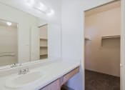 Thumbnail 17 of 21 - the preserve at ballantyne commons apartment bathroom with sink and mirror