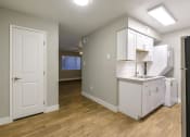 Thumbnail 2 of 10 - an empty kitchen with a sink and a refrigerator