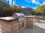 Thumbnail 9 of 10 - a barbecue grill sitting on top of a sidewalk