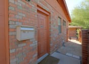 Thumbnail 15 of 16 - a brick building with a mailbox on the side of it
