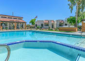 Thumbnail 6 of 19 - a large swimming pool with apartments in the background at Tides on Southern, Mesa, 85204