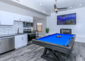 Thumbnail 3 of 17 - a games room with a pool table and a kitchen at Tides at Mesa, Arizona