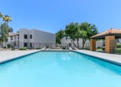 Thumbnail 7 of 17 - a large swimming pool with a building in the background at Tides at Mesa, Mesa, AZ, 85204