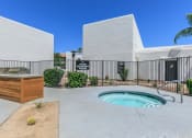 Thumbnail 6 of 17 - a hot tub is outside of a building with a hot pool at Tides at Mesa, Arizona