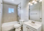 Thumbnail 8 of 10 - a bathroom with a sink toilet and bathtub