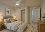 Thumbnail 18 of 24 - A bedroom with a large bed and a plant on the nightstand at Connect on Northern, Glendale, AZ 85301