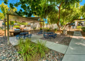 Thumbnail 11 of 13 - a picnic area with benches and tables under a canopy at Connect on Northern, Glendale