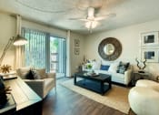Thumbnail 3 of 13 - a living room with furniture and a ceiling fan at Connect on Northern, Glendale