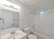 Thumbnail 3 of 14 - a bathroom with a sink toilet and a shower
