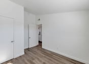 Thumbnail 4 of 14 - our apartments offer a living room with a door to the bedroom