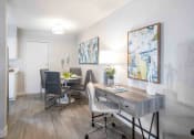 Thumbnail 6 of 24 - a dining room with a table and chairs