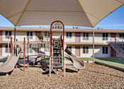Thumbnail 17 of 21 - Playground with a slide at Windrose Villas Apartments, Phoenix, 85029
