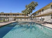Thumbnail 13 of 21 - Outdoor Swimming Pool at Windrose Villas Apartments, Arizona