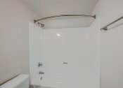 Thumbnail 7 of 14 - a bathroom with a shower and a tub