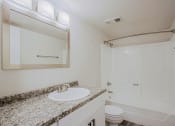 Thumbnail 6 of 14 - a bathroom with a sink toilet and shower