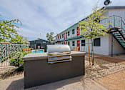 Thumbnail 16 of 20 - A silver car is parked on a concrete block.