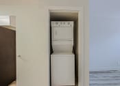 Thumbnail 7 of 12 - a room with a washer and dryer in it