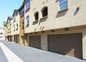 Thumbnail 11 of 14 - a row of garage doors on the side of a building