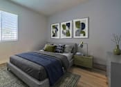 Thumbnail 7 of 16 - A bedroom with a bed, nightstand, and a window with blinds.