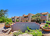 Thumbnail 93 of 94 - The Scottsdale Hacienda sign is in front of a building with a clear blue sky in the background.
